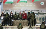 Les otages (G à D) Yair Horn, Sagui Dekel-Chen et Sasha Trupanov exhibés sur un podium avant leur libération à Gaza, le 15 février 2025