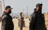 Les forces de sécurité américaines et égyptiennes montent la garde à un poste de contrôle au corridor de Netzarim, dans le centre de Gaza, le 29 janvier 2025