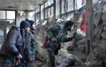 Des soldats du régime syrien le 8 décembre 2016 dans un quartie d'Alep-Est