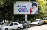 Cars drive by a poster depicting Iran's supreme leader Ayatollah Ali Khamenei in the capital Tehran on July 31, 2018