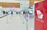 Les comptoirs d'enregistrement de la compagnie Virgin Australia dans le hall des départs de l'aéroport d'Adelaide, en Australie, le 21 avril 2020