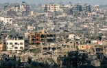 Une vue des bâtiments détruits dans le territoire palestinien à la suite de bombardements, depuis la frontière sud d'Israël avec la bande de Gaza, le 19 mars 2024