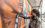 L'artiste béninois Romario Agbo-Koffi pendant le festival Effet Graff, le 18 mai 2022 à Cotonou, au Bénin