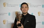 Le réalisateur japonais Ryusuke Hamaguchi remporte le prix du meilleur film en langue étrangère aux BAFTA, le 13 mars 2022 à Londres