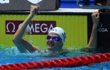 La Française Marie Watttel après sa victoire en demi-finales sur 100 m papillon aux Mondiaux de natation, le 21 juillet 2019 à Gwangju