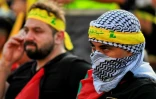 Des partisans du Hezbollah regardent un discours télévisé de son chef Hassan Nasrallah dans la banlieue sud de Beyrouth, le 3 novembre 2023 au Liban