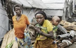 Des familles quittent le camp de déplacés  de Lwashi, à Goma, dans l'est de la RDC, le 11 février 2025