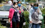 Des Iraniennes portent un masque de protection dans une rue de Téhéran, le 28 juin 2020