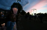 Procession aux flambeaux à la gloire de la Vierge Marie à Lourdes le 14 août 2022