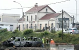 Des véhicules calcinés le 21 octobre 2015 devant la gare de Moirans au lendemain des violences commises la veille  par des gens du voyage
