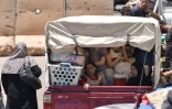 Des déplacés par l'offensive du régime dans la province méridionale de Deraa en Syrie sur le chemin du retour, le 11 juillet 2018