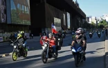Des motards lors d'une manifestation contre la politique du gouvernement à Santiago du Chili, le 9 novembre 2019