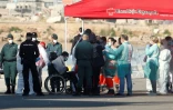 Un migrant sur une chaise roulante à son arrivée au port de Valence en Espagne le 17 juin 2018