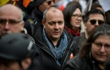 Le secrétaire général de la CFDT Laurent Berger (C), le 28 mars 2023 lors d'une manifestation contre la réforme des retraites à Paris
