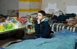 Alex, 14 ans, qui vit avec sa famille dans un parking souterrain Ă l'abri des bombes, le 23 avril 2022 Ă Kharkiv, en Ukraine