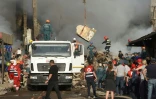Des équipes de secours sur le site d'une explosion d'origine indéterminée qui a fait au moins six morts dans une zone commerciale d'Erevan, le 14 août 2022 en Arménie