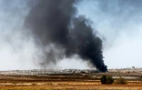 Une photo prise depuis la frontière sud d'Israël avec la bande de Gaza montre de la fumée s'élevant au-dessus de Gaza, le 9 juillet 2024
