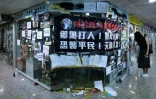 Des affiches placardées par des manifestants sur la permanence d'un député pro-Pékin, à Hong Kong le 22 juillet 2019