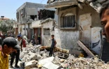 Des Palestiniens fouillent les décombres après un bombardement israélien à Nousseirat, dans le centre de la bande de Gaza, le 2 juin 2025