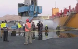 Capture d'image de la télévision d'Etat al-Mamlaka du site où la chute d'un conteneur a entraîné une dispersion de chlore au port d'Aqaba, le 27 juin 2022 en Jordanie