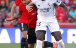 Ferland Mendy en action contre le milieu du RCD Majorque Daniel Rodriguez (en rouge) en match de Coupe au Son Moix stadium de Palma de Majorque le 13 avril 2024