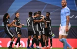 Les Lyonnais exultent après un but de Moussa Dembélé contre Manchester City, en quart de finale de la C1, le 15 août 2020 à Lisbonne