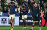 L'ailier Damian Penaud, le talonneur Peato Mauvaka et le demi d'ouverture Matthieu Jalibert après la défaite de la France lors du quart de finale du Mondial 2023 contre l'Afrique du Sud, à Saint-Denis, le 15 octobre 2023