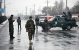 Des membres des forces de sécurité près de l'Académie militaire de Kaboul où s'est déroulé une attaque meurtrière le 29 janvier 2018
