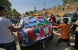 Une voiture couverte de portraits du Premier ministre palestinien Rami Hamdallah Ă Beit Hanun, dans la bande de Gaza, le 2 octobre 2017