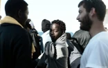 Photo fournie par l'ONG Medecins Sans Frontieres et SOS Mediterranée le 16 juin 2018 montrant des migrants à bord de l'Aquarius en route vers le port de Valence, en Espagne