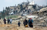 Des Palestiniens dans les ruines de Beit Lahia, dans le nord de la bande de Gaza, le 11 février 2025