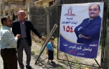 Photo prise le 19 avril 2018 à Erbil, au Kurdistan irakien, montrant une affiche de campagne de Basil Gorgis, un ancien international de football aujourd'hui candidat aux législatives
