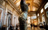 Hirst used traditional materials like bronze that almost blend in to the historic artworks around them