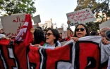 Des Tunisiens opposés au président Kais Saied lors d'une manifestation à Tunis le 4 octobre 2024