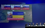 Les portraits des Russes Sergueï Doubinski, Igor Guirkine et Oleg Poulatov et de l'Ukrainien Leonid Khartchenko lors d'une conférence de presse de l'équipe internationale d'enquêteurs sur les causes du crash du vol MH17, le 19 juin 2019 à Nieuwegein, aux Pays-Bas