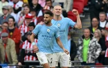Le milieu de terrain algérien de Manchester City Riyad Mahrez (à gauche) et l'attaquant norvégien Erling Haaland lors de la demi-finale de FA Cup contre Sheffield United à Wembley le 22 avril 2023
