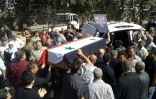 Photo diffusée le 26 juillet 2018 par l'agence de presse syrienne Sana montrant les funérailles de l'une des victimes des attaques commises le 25 juillet 2018 par l'EI dans la ville de Soueida, dans le sud de la Syrie