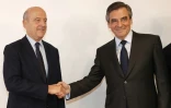 Les deux finalistes de la primaire de la droite François Fillon et Alain Juppé se serre la main après l'annonce des résultats le 27 novembre 2016 à Paris