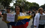 Des partisans de l'opposant et président autoproclamé du Venezuela Juan Guaido, lors d'une manifestation à Caracas le 10 avril 2019

