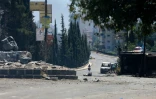 Une rue dévastée après deux jours de violences à Soueida, dans le sud de la Syrie, le 15 juillet 2025
