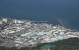 Vue aérienne des réservoirs d'eau traitée de la centrale nucléaire de Fukushima Daiichi, le 24 août 2023 au Japon