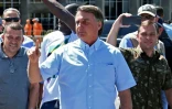 Jair Bolsonaro (c), alors président, à Brasilia, le 1er mai 2022