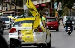 Des partisans du Hezbollah circulent dans les rue de Nabatieh dans le sud du Liban, le 6 mai 2018