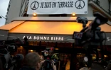 Une pancarte "Je suis en terrasse", placardée au-dessus du bar "A la Bonne Biere" visé par les attentats, photographiée à Paris le 4 décembre 2015