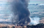 Colonnes de fumée après la chute d'une roquette tirée depuis le sud du Liban sur la région de la Haute Galilée, dans le nord d'Israël, le 21 juillet 2024