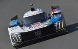 Le pilote américain Gustavo Menezes au volant de la Peugeot 9X8 Hypercar WEC lors d'essais   le 4 juin 2023 en amont de la course des 24 heures du Mans sur le circuit du Mans en France