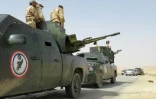 Les forces du régime syrien autour de Palmyre, lors d'une opération pour reprendre la ville aux rebelles, le 25 mars 2016, en Syrie