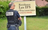 Un policier sécurise les lieux de la perquisition à Oullins, près de Lyon, le 27 mai 2019