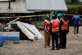 Des enquêteurs devant l'Académie Hillside Endarasha du comté de Nyeri après un incendie qui a tué 17 enfants, le 6 septembre 2024 au Kenya