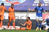 La joie des attaquants strabourgeois, l'Algérien Andy Delort (g) et le Français Gaëtan Laborde, après un but marqué contre Strasbourg, lors de leur match de L1, le 9 mai 2021 au stade de La Meinau